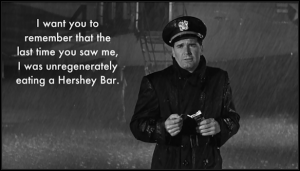 the-americanization-of-emily-charlie-in-the-rain-unregenerately-eating-a-hershey-bar